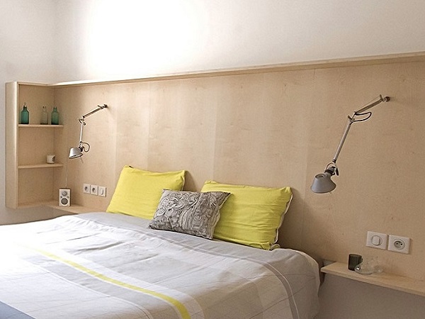 Bedroom with Headboard Shelving Green Bedspread